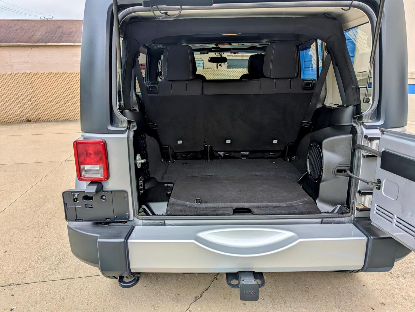 2013 Silver Metallic /Black Jeep Wrangler Unlimited Sahara 4WD (1C4BJWEG3DL) with an 3.6L V6 DOHC 24V FFV engine, Automatic transmission, located at 603 Amelia Street, Plymouth, MI, 48170, (734) 459-5520, 42.378841, -83.464546 - Vehicles shown by appointment - Please call ahead - 734-459-5520, text 734-658-4573 or contact us via our web site at: http://www.selectmotors.com for complete Inventory, Photos, Videos and FREE Carfax Reports. 2013 Jeep Wrangler Unlimited Sahara. Billet Silver Metallic with black interior, 175K - Photo#6