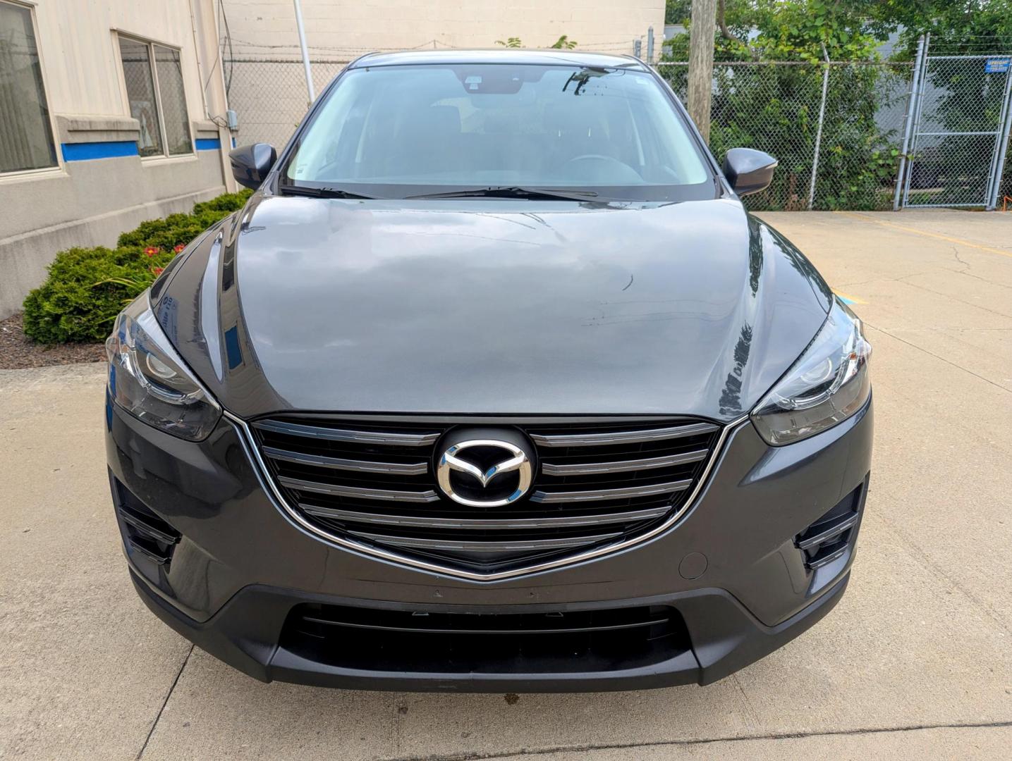 2016 Meteor Gray Mica /Black Leather Mazda CX-5 Grand Touring AWD (JM3KE4DY5G0) with an 2.5L L4 DOHC 16V engine, 6-Speed Automatic transmission, located at 603 Amelia Street, Plymouth, MI, 48170, (734) 459-5520, 42.378841, -83.464546 - Vehicles shown by appointment - Please call ahead - 734-459-5520, text 734-658-4573 or contact us via our web site at: http://www.selectmotors.com for complete Inventory, Photos, Videos and FREE Carfax Reports. 2016 Mazda CX5 Grand Touring, Meteor Gray Mica, Black leather interior, 134K one owner - Photo#1