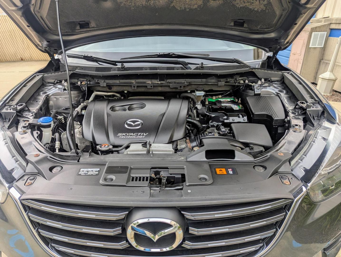 2016 Meteor Gray Mica /Black Leather Mazda CX-5 Grand Touring AWD (JM3KE4DY5G0) with an 2.5L L4 DOHC 16V engine, 6-Speed Automatic transmission, located at 603 Amelia Street, Plymouth, MI, 48170, (734) 459-5520, 42.378841, -83.464546 - Vehicles shown by appointment - Please call ahead - 734-459-5520, text 734-658-4573 or contact us via our web site at: http://www.selectmotors.com for complete Inventory, Photos, Videos and FREE Carfax Reports. 2016 Mazda CX5 Grand Touring, Meteor Gray Mica, Black leather interior, 134K one owner - Photo#17