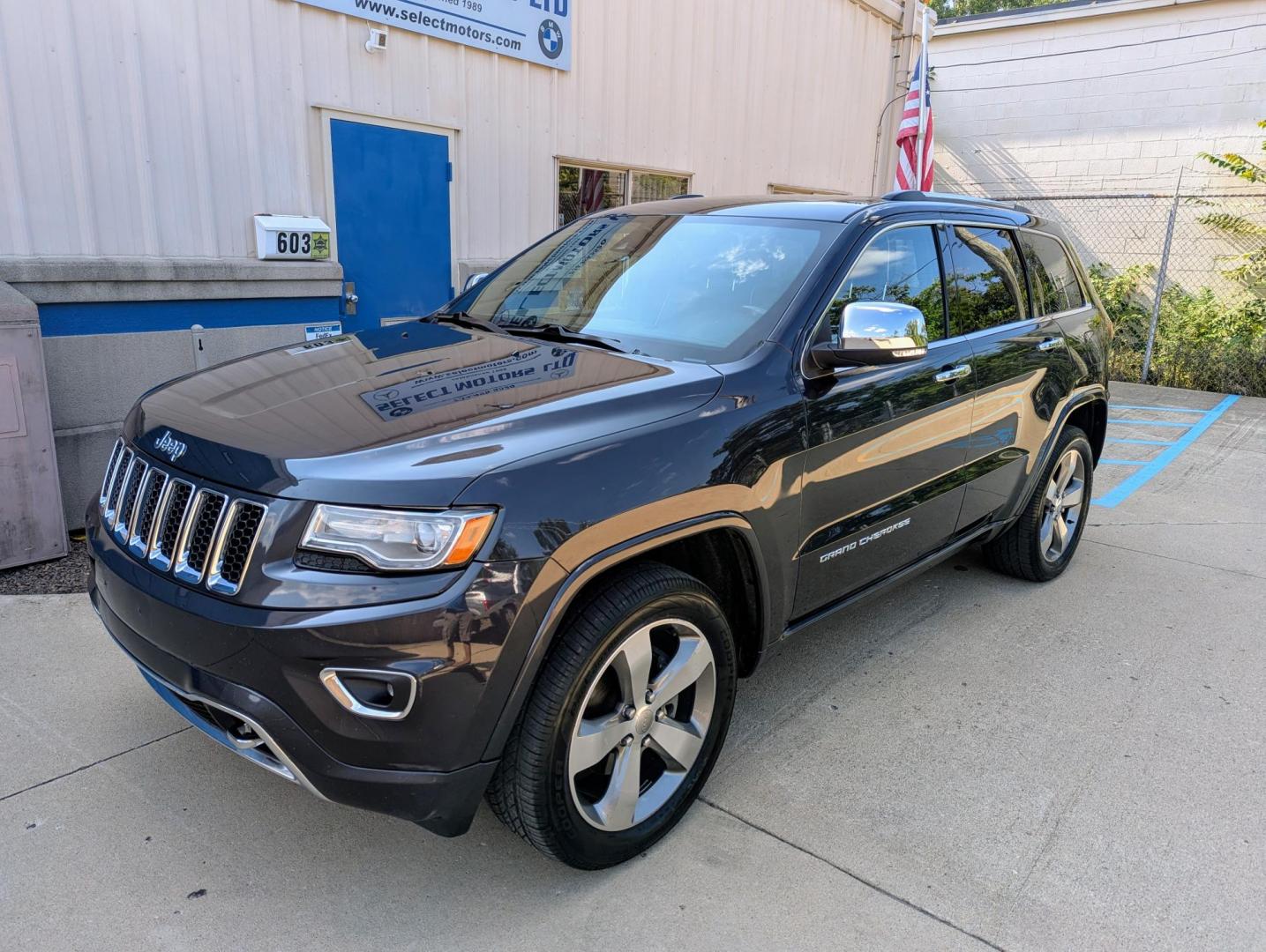 2014 Maximum Steel Metallic /Indigo Blue & Brown Leather Jeep Grand Cherokee Overland 4WD (1C4RJFCG5EC) with an 3.6L V6 DOHC 24V engine, 5-Speed Automatic transmission, located at 603 Amelia Street, Plymouth, MI, 48170, (734) 459-5520, 42.378841, -83.464546 - Vehicles shown by appointment - Please call ahead - 734-459-5520, text 734-658-4573 or contact us via our web site at: http://www.selectmotors.com for complete Inventory, Photos, Videos and FREE Carfax Reports. 2014 Jeep Grand Cherokee Overland, Maximum Steel Metallic with Indigo Blue & Brown int - Photo#0