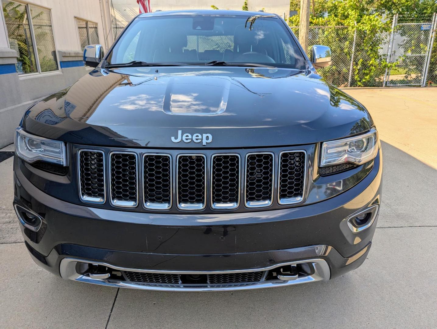2014 Maximum Steel Metallic /Indigo Blue & Brown Leather Jeep Grand Cherokee Overland 4WD (1C4RJFCG5EC) with an 3.6L V6 DOHC 24V engine, 5-Speed Automatic transmission, located at 603 Amelia Street, Plymouth, MI, 48170, (734) 459-5520, 42.378841, -83.464546 - Vehicles shown by appointment - Please call ahead - 734-459-5520, text 734-658-4573 or contact us via our web site at: http://www.selectmotors.com for complete Inventory, Photos, Videos and FREE Carfax Reports. 2014 Jeep Grand Cherokee Overland, Maximum Steel Metallic with Indigo Blue & Brown int - Photo#1