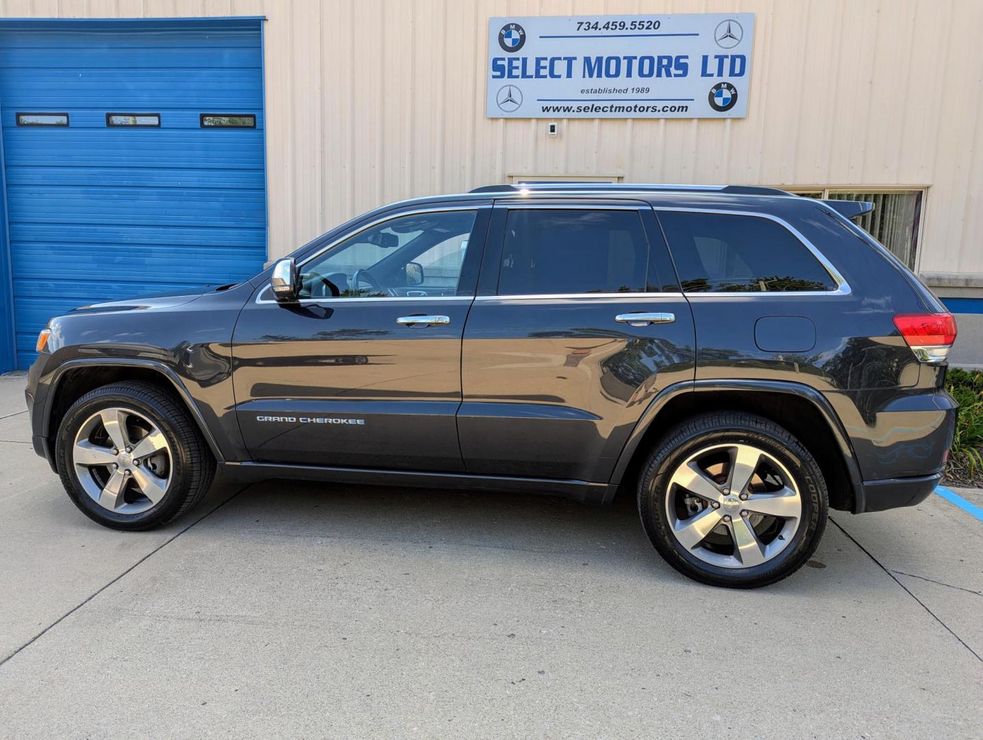 2014 Maximum Steel Metallic /Indigo Blue & Brown Leather Jeep Grand Cherokee Overland 4WD (1C4RJFCG5EC) with an 3.6L V6 DOHC 24V engine, 5-Speed Automatic transmission, located at 603 Amelia Street, Plymouth, MI, 48170, (734) 459-5520, 42.378841, -83.464546 - Vehicles shown by appointment - Please call ahead - 734-459-5520, text 734-658-4573 or contact us via our web site at: http://www.selectmotors.com for complete Inventory, Photos, Videos and FREE Carfax Reports. 2014 Jeep Grand Cherokee Overland, Maximum Steel Metallic with Indigo Blue & Brown int - Photo#2