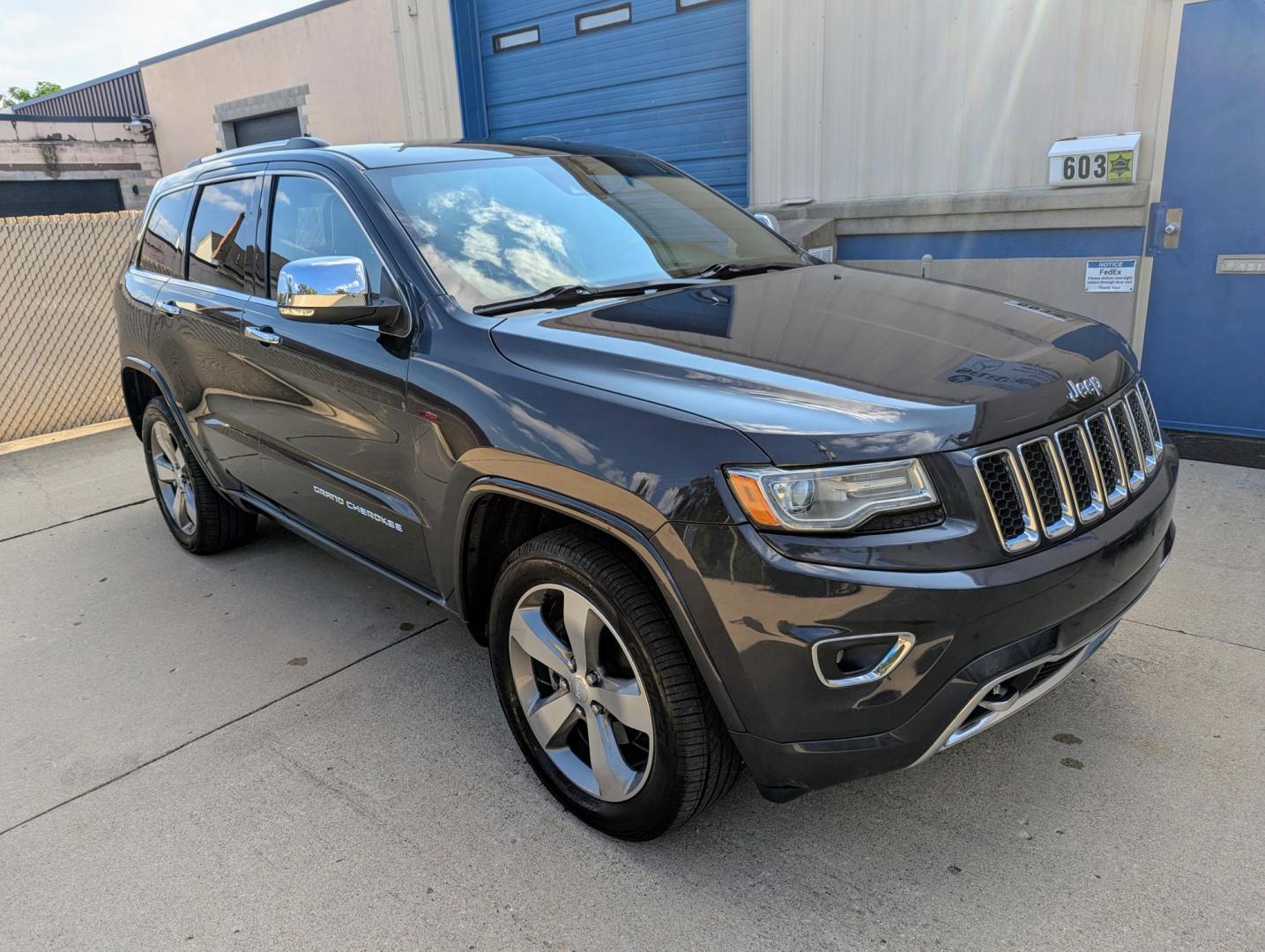 2014 Maximum Steel Metallic /Indigo Blue & Brown Leather Jeep Grand Cherokee Overland 4WD (1C4RJFCG5EC) with an 3.6L V6 DOHC 24V engine, 5-Speed Automatic transmission, located at 603 Amelia Street, Plymouth, MI, 48170, (734) 459-5520, 42.378841, -83.464546 - Vehicles shown by appointment - Please call ahead - 734-459-5520, text 734-658-4573 or contact us via our web site at: http://www.selectmotors.com for complete Inventory, Photos, Videos and FREE Carfax Reports. 2014 Jeep Grand Cherokee Overland, Maximum Steel Metallic with Indigo Blue & Brown int - Photo#9