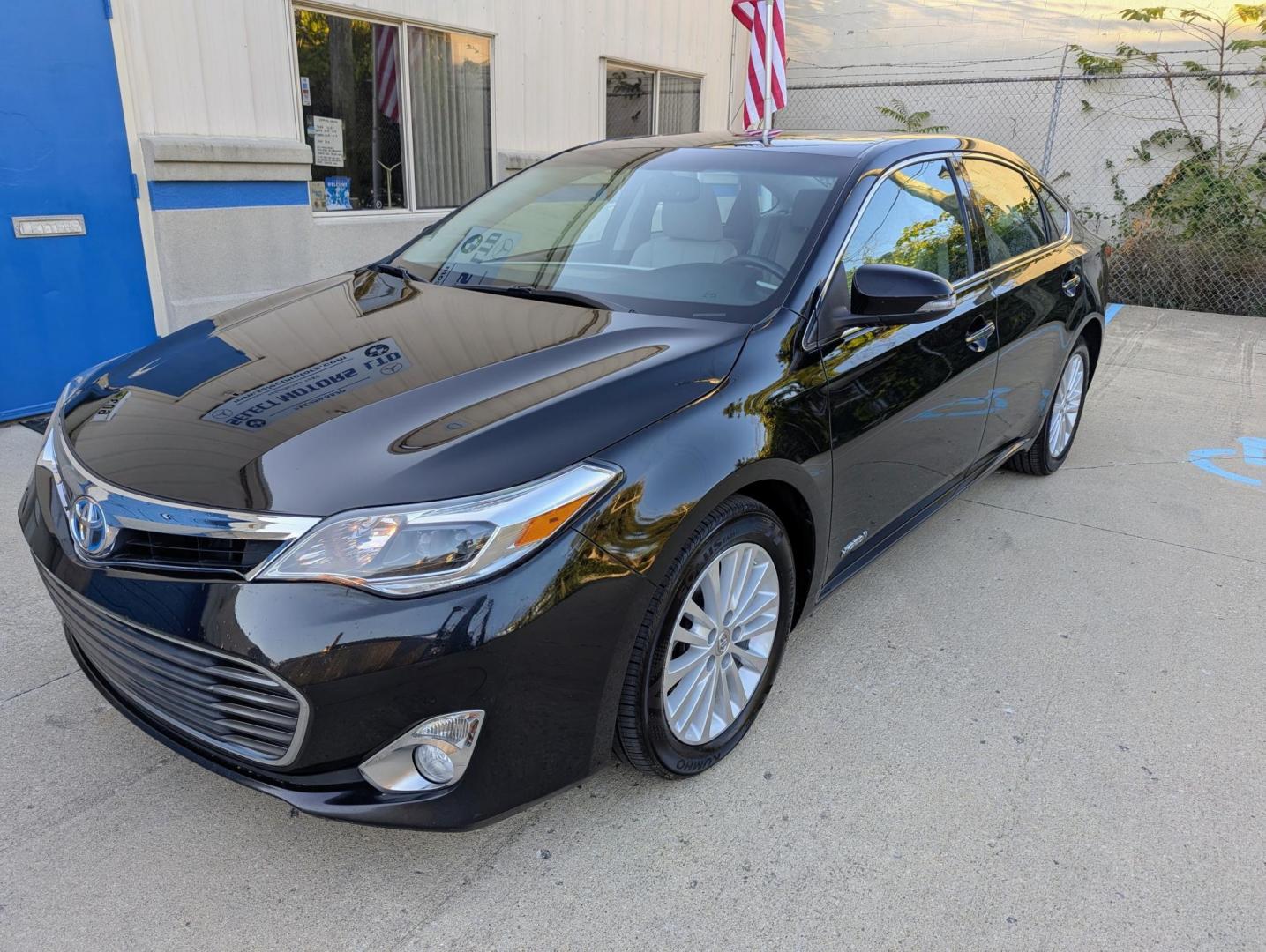 2014 Black /Light Gray Leather Toyota Avalon Hybrid XLE Premium (4T1BD1EB9EU) with an 2.5L L4 DOHC 16V HYBRID engine, Continuously Variable Transmission transmission, located at 603 Amelia Street, Plymouth, MI, 48170, (734) 459-5520, 42.378841, -83.464546 - Vehicles shown by appointment - Please call ahead - 734-459-5520, text 734-658-4573 or contact us via our web site at: http://www.selectmotors.com for complete Inventory, Photos, Videos and FREE Carfax Reports. 2014 Toyota Avalon, Hybrid - Touring, Black with light gray leather interior, 95K one - Photo#0