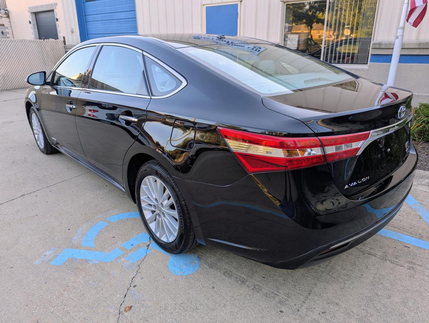 2014 Black /Light Gray Leather Toyota Avalon Hybrid XLE Premium (4T1BD1EB9EU) with an 2.5L L4 DOHC 16V HYBRID engine, Continuously Variable Transmission transmission, located at 603 Amelia Street, Plymouth, MI, 48170, (734) 459-5520, 42.378841, -83.464546 - Vehicles shown by appointment - Please call ahead - 734-459-5520, text 734-658-4573 or contact us via our web site at: http://www.selectmotors.com for complete Inventory, Photos, Videos and FREE Carfax Reports. 2014 Toyota Avalon, Hybrid - Touring, Black with light gray leather interior, 95K one - Photo#3