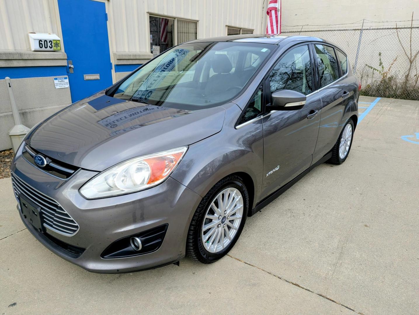 2013 Sterling Grey Metallic /Charcoal Black Leather Ford C-Max SEL (1FADP5BU3DL) with an 2.0L L4 DOHC 16V HYBRID engine, Continuously Variable Transmission transmission, located at 603 Amelia Street, Plymouth, MI, 48170, (734) 459-5520, 42.378841, -83.464546 - Photo#0