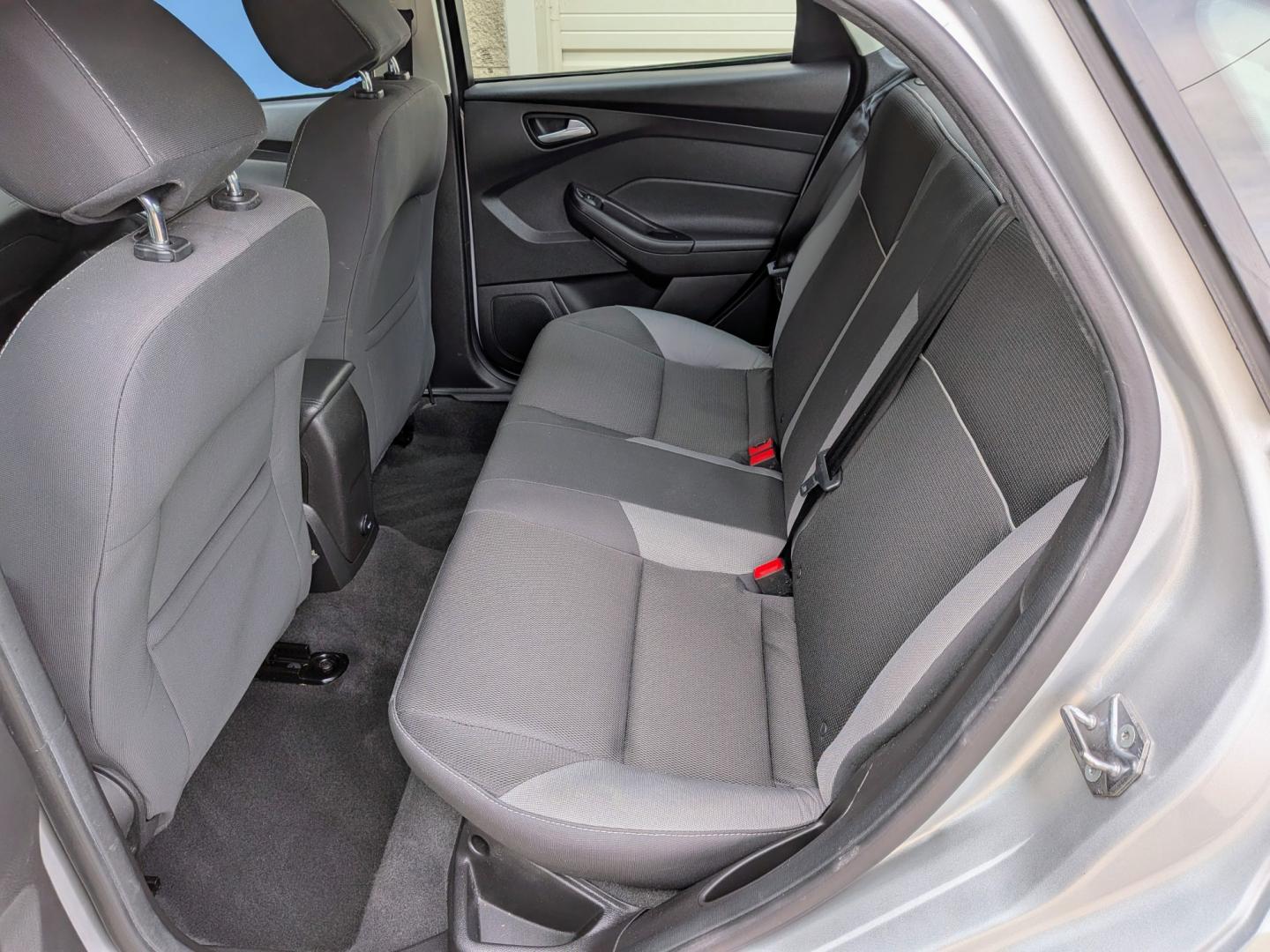 2014 Silver /Black Ford Focus SE Sedan (1FADP3F21EL) with an 2.0L L4 DOHC 16V engine, Automatic transmission, located at 603 Amelia Street, Plymouth, MI, 48170, (734) 459-5520, 42.378841, -83.464546 - Vehicles shown by appointment - Please call ahead - 734-459-5520, text 734-658-4573 or contact us via our web site at: http://www.selectmotors.com for complete Inventory, Photos, Videos and FREE Carfax Reports. 2014 Ford Focus SE Sedan – Only 32k Miles! Price: $8,995 (Includes Document Fee- Photo#5