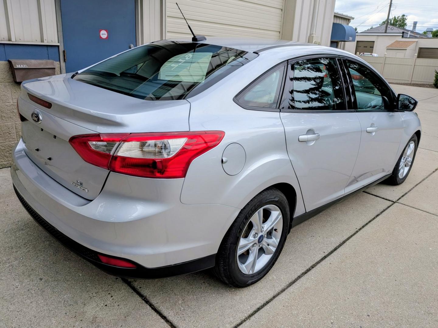 2014 Silver /Black Ford Focus SE Sedan (1FADP3F21EL) with an 2.0L L4 DOHC 16V engine, Automatic transmission, located at 603 Amelia Street, Plymouth, MI, 48170, (734) 459-5520, 42.378841, -83.464546 - Vehicles shown by appointment - Please call ahead - 734-459-5520, text 734-658-4573 or contact us via our web site at: http://www.selectmotors.com for complete Inventory, Photos, Videos and FREE Carfax Reports. 2014 Ford Focus SE Sedan – Only 32k Miles! Price: $8,995 (Includes Document Fee- Photo#12